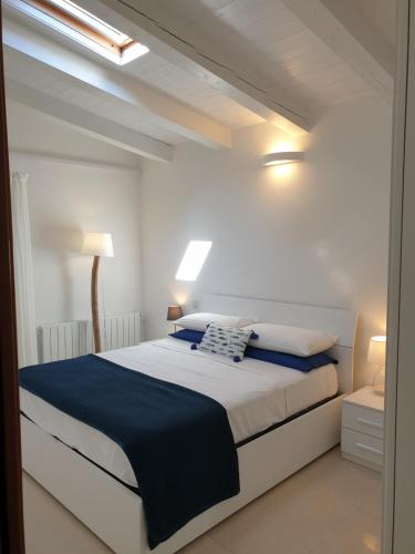 Ein Bett oder Betten in einem Zimmer der Unterkunft Cottage al mare Martina