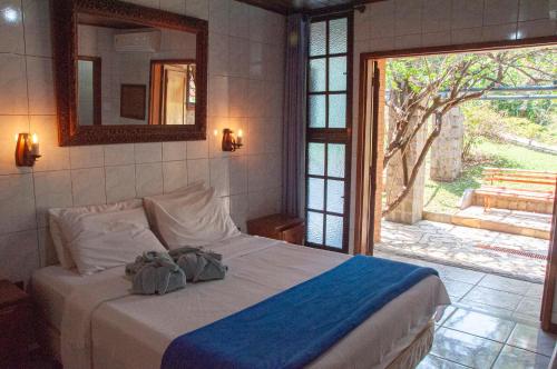 Tempat tidur dalam kamar di Hotel Bougainville
