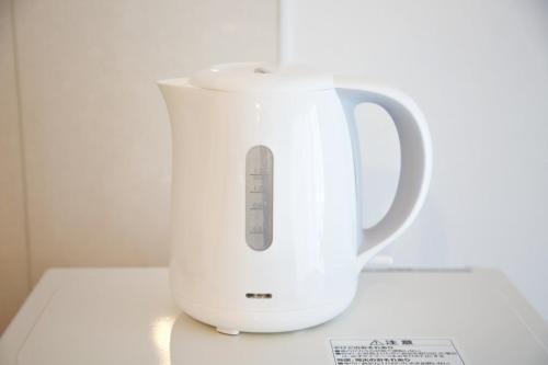 a white blender sitting on top of a counter at Vent du Vent302 in Minatogawa