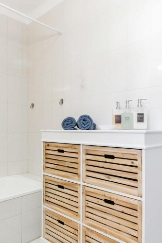a bathroom with a sink and a tub at Beachfront Villa with Private Pool in Manta Rota in Vila Nova De Cacela