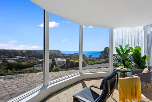 
a view from a balcony of a house with a view of the ocean at Views Forever - Devonport in Devonport
