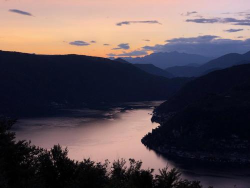 a view of a river at sunset at Locanda San Silvestro - Meride in Mendrisio