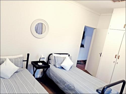 Postel nebo postele na pokoji v ubytování Ambiente Budget Accommodation
