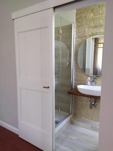 a bathroom with a shower and a sink at B&B Suite 44 in Pesaro