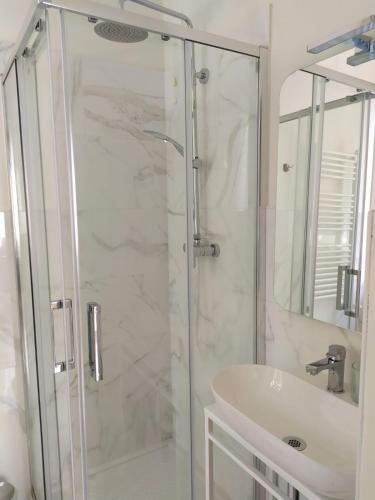 a bathroom with a shower and a sink at B&B Suite 44 in Pesaro