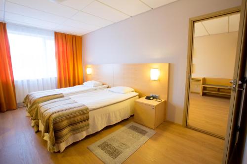 Postel nebo postele na pokoji v ubytování Viimsi Spa & Waterpark