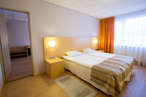 Postel nebo postele na pokoji v ubytování Viimsi Spa & Waterpark