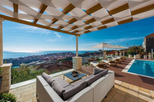 a villa with a swimming pool and a patio at Villa Vega in Dubrovnik