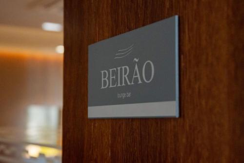 a sign on a door with the word benzo on it at Luna Hotel de Tábua in Tábua