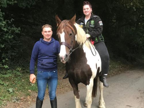 two people are standing next to a horse and a woman at Yeovil Accomodation Business & Pleasure, 2 dble Bedrooms, Bathroom en-suite, Kitchen, Lounge, Diner, Garden, 365 acres Forest & Streams, Workers huts available with lrge Van parking in Montacute
