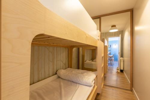 Ένα ή περισσότερα κρεβάτια σε δωμάτιο στο Rare ! Appartement rénové dans le village piéton de Megève