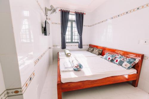 Giường trong phòng chung tại Motel Phạm Lũy