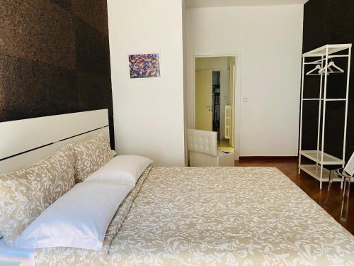a bedroom with a large bed and a mirror at Via del Corso Room&Suite in Matera