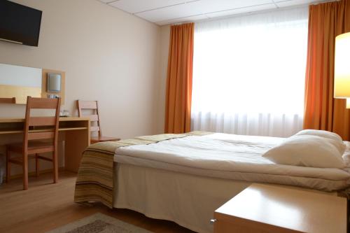 Postel nebo postele na pokoji v ubytování Viimsi Spa & Waterpark