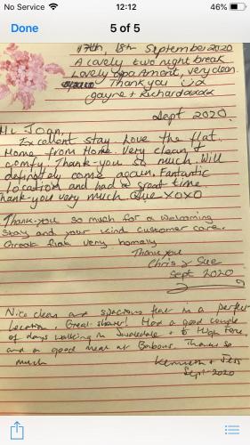 a letter written in cursive handwriting with pink flowers at 5B, Market Place flats in Barnard Castle