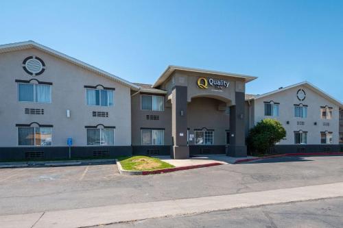 a building with a sign on the front of it at Quality Inn Midvale - Salt Lake City South in Midvale