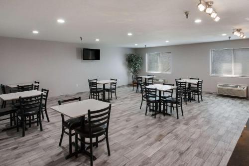 a dining room with tables and chairs in it at Quality Inn Midvale - Salt Lake City South in Midvale