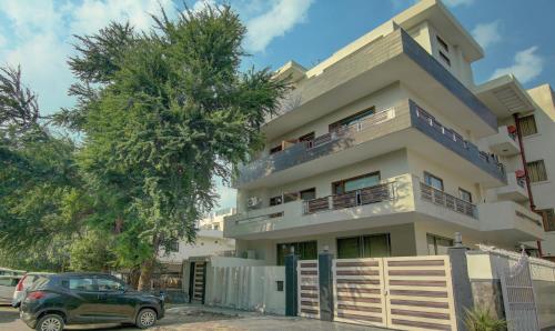 a house with a car parked in front of it at Itsy By Treebo - Swastika Inn in Noida