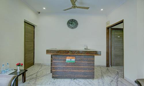 a kitchen with a counter in a room with a ceiling at Itsy By Treebo - Swastika Inn in Noida