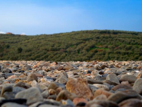 a large pile of rocks on a mountain at Conte Marino Villas in Maleme