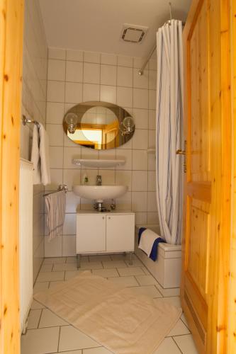 a bathroom with a sink and a shower at Naturlaub.pur in Waldmünchen