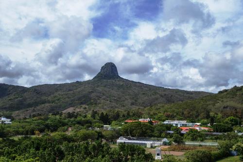 a mountain in the middle of a city with a town at Kenting Sunhow Inn in Kenting