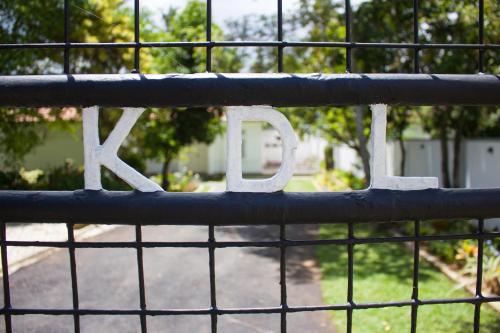 a metal fence with the word zoo written on it at Villa Lewis in Badulla