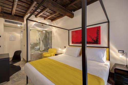 a bedroom with a large bed and a bathroom at Argileto Aqua in Rome