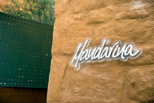 a sign on the side of a wall with the word euphoria at Conte Marino Villas in Maleme