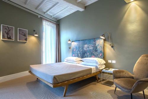 En eller flere senge i et værelse på Hotel Accademia