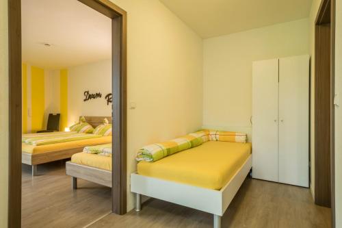 Postel nebo postele na pokoji v ubytování Ferienwohnung Jasmin