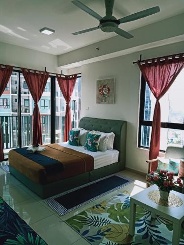 a bedroom with a large bed and windows at Studio I-Soho D'Gunduls Homestay by DGH I-CITY in Shah Alam