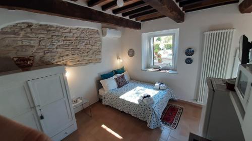 Voodi või voodid majutusasutuse Casale di Nicolò toas