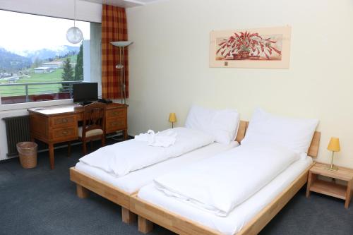 מיטה או מיטות בחדר ב-Holiday Apartment
