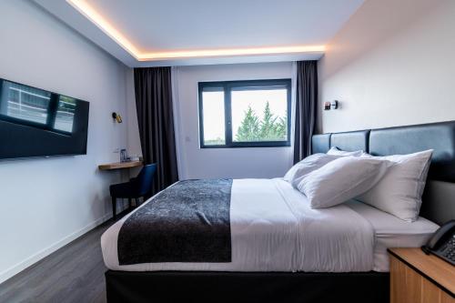 Llit o llits en una habitació de Woods Genève-Thoiry