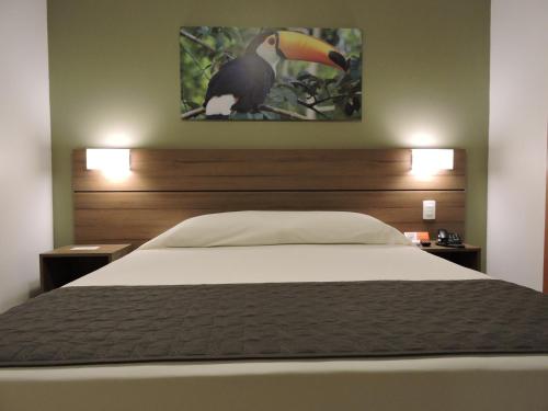 Ein Bett oder Betten in einem Zimmer der Unterkunft Bristol Umarizal Belem