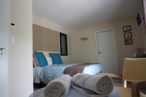 Postel nebo postele na pokoji v ubytování Maison Cube
