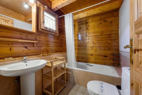 a bathroom with a sink and a toilet and a tub at MAIANS - Peu del Riu 122 - Vall d'Incles - Soldeu in Incles