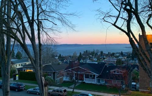 a view of a town at sunset with houses at Puget Sound View, Best Area, 2 Baths, 2 Bedrooms, WD, Jacuzzi Bath, New Carpet, Balcony, View, 925sf in Tacoma