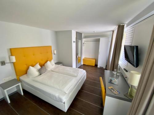 Postel nebo postele na pokoji v ubytování Altstadt Hotel Baunachshof