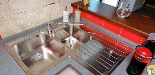 a stainless steel sink in a kitchen with a counter at Il Palazzotto in Isernia