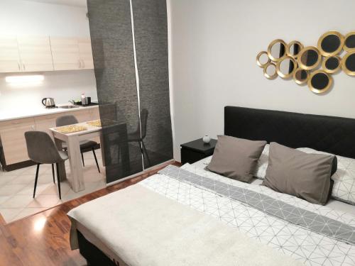Postel nebo postele na pokoji v ubytování Metropole De Luxe Suite