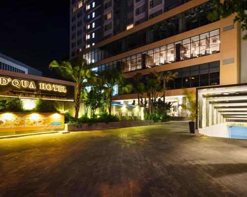 an empty street in front of a building at night at DQua Hotel in Nha Trang