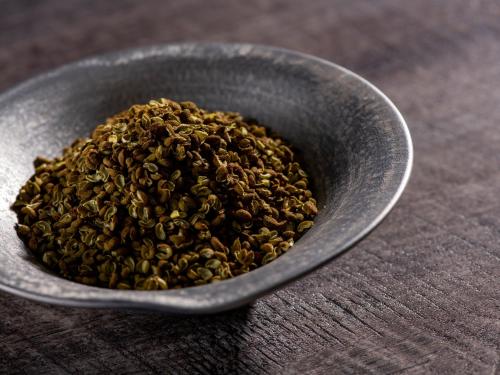 a gray bowl filled with seeds on a table at ART HOTEL Miyazaki Sky Tower in Miyazaki
