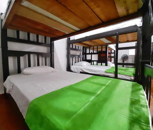 Кровать или кровати в номере Hospederia Sol del Desierto