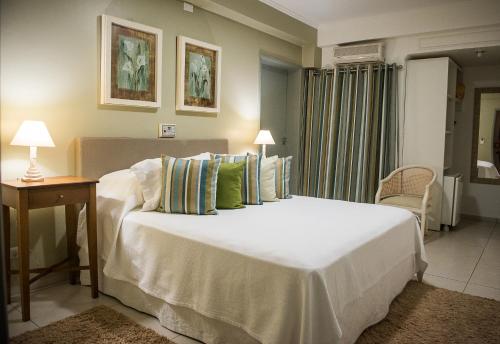 Ένα ή περισσότερα κρεβάτια σε δωμάτιο στο Hotel Pousada Ourinhos