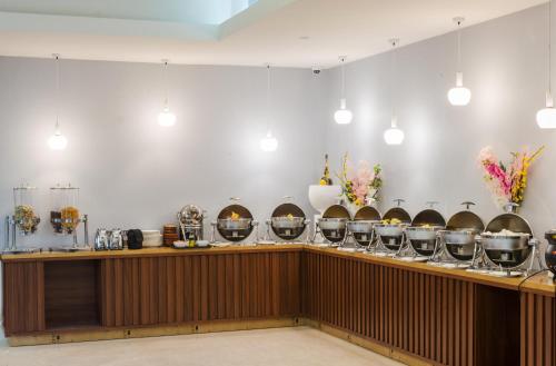 a bar with a row of wine glasses at Art View Hotel - Riyadh Convention & Exhibition Center in Riyadh