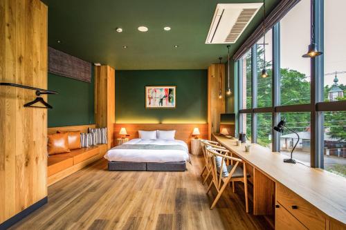 Postel nebo postele na pokoji v ubytování HOTEL KARUIZAWA CROSS