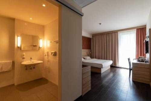 Um banheiro em Star G Hotel Premium München Domagkstraße