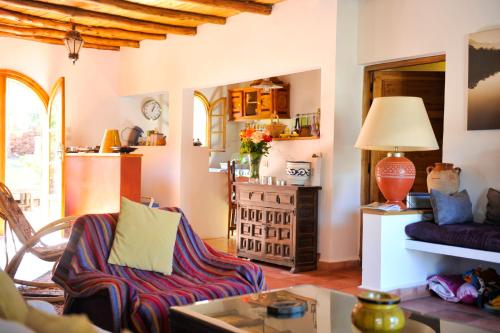 a living room with a couch and a table at Villa sur le lac Bin el ouidane in Aït Irizane